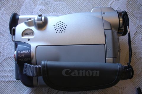 1993 Ford Taurus - A silver Canon camcorder is shown from the side, displaying its controls and branding.