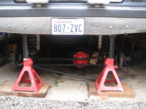1987 Ford Bronco - The underside of a vehicle is shown, with the rear axle assembly visible.