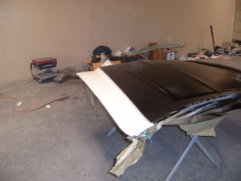 1973 Ford Ranchero - Hood undergoing paint work, a two-tone black and white stripe design.