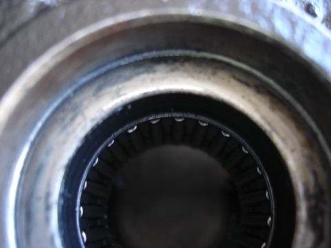 1992 Ford Bronco - A close-up view of a metal bearing race, showing its internal splined structure.