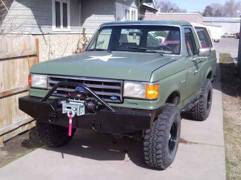 1989 Ford Bronco - This 1989 Ford Bronco features a heavy-duty winch bumper and off-road tires.