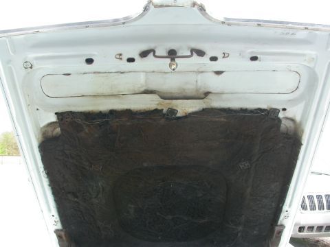 1968 Mercury Cougar - The underside of a car's hood is shown, revealing insulation and the latch mechanism.