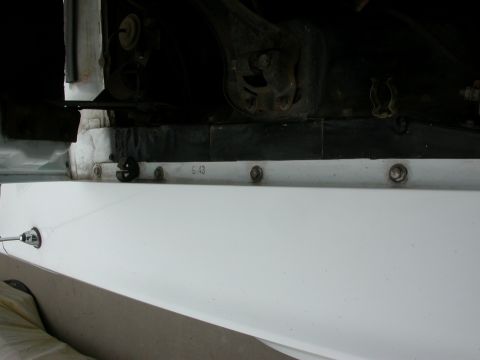 1968 Mercury Cougar - Visible text 'G.43' on a car part, with suspension components in the background.
