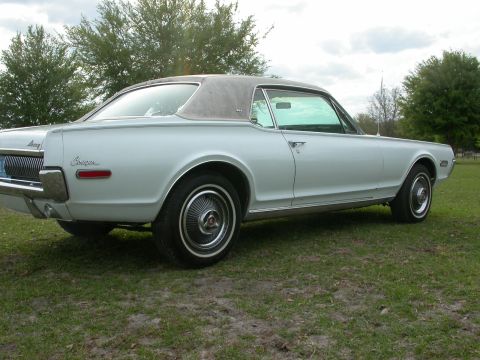 1968 Mercury Cougar - Rear three-quarter view of a 1968 Mercury Cougar with a vinyl top.