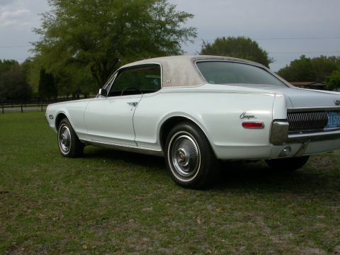 1968 Mercury Cougar - This 1968 Mercury Cougar is shown from the rear quarter angle with a light-colored vinyl roof.