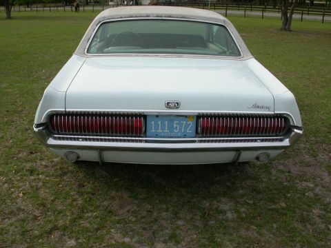 1968 Mercury Cougar - Rear view of a white 1968 Mercury Cougar with a vertical grille and a Florida antique license plate.