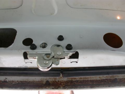 1968 Mercury Cougar - The trunk latch mechanism is visible, with some rust on the surrounding metal.