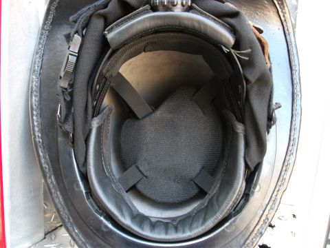 1992 Ford F-150 - Close-up view of the inside of a black leather helmet, showing the padding and adjustable straps.