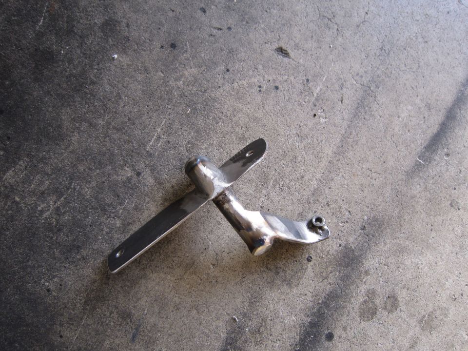 Chrome mirror bracket on concrete surface