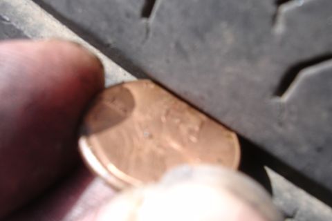 1993 Ford Taurus - Checking tire tread depth with a penny.