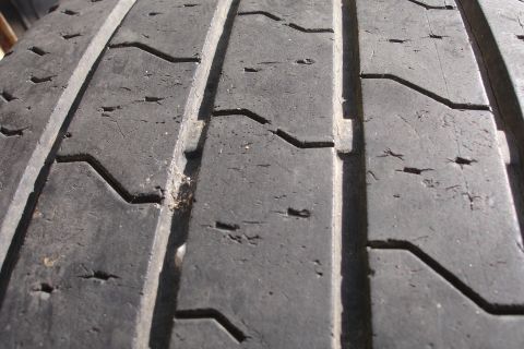 1993 Ford Taurus - Close-up view of a tire's tread pattern, showing signs of wear and tear.