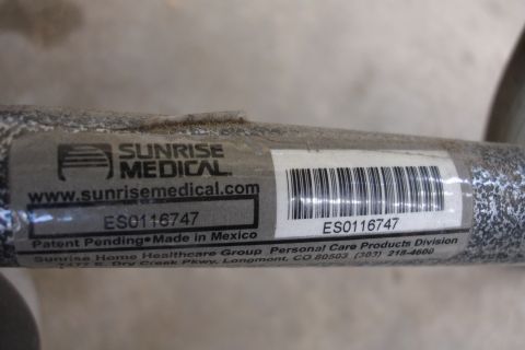 1993 Ford Taurus - A label on a metal tube shows manufacturer information and a product serial number.