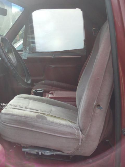 1988 Ford Bronco - The interior of a 1988 Ford Bronco, a worn driver's seat and visible dashboard elements.