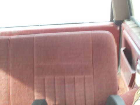 1988 Ford Bronco - Interior view of a vehicle's rear bench seat, showing the fabric upholstery.