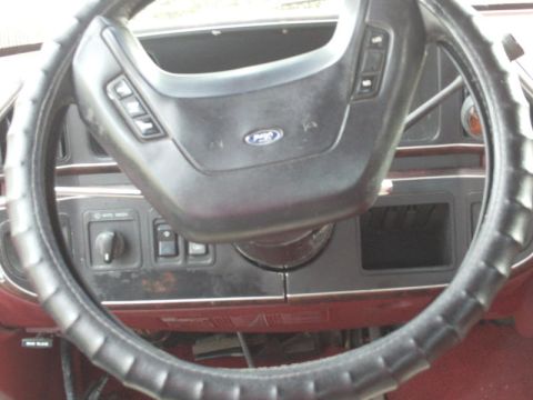 1988 Ford Bronco - Interior view of a 1987 Ford Bronco, focusing on the steering wheel and dashboard controls.