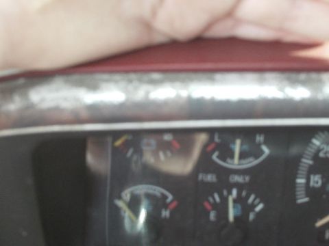 1988 Ford Bronco - A close-up view of a vehicle's dashboard gauges, including fuel indicators.