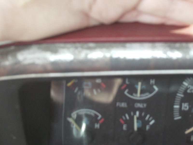 Dashboard gauges with 'FUEL ONLY' text and a hand obscuring the top