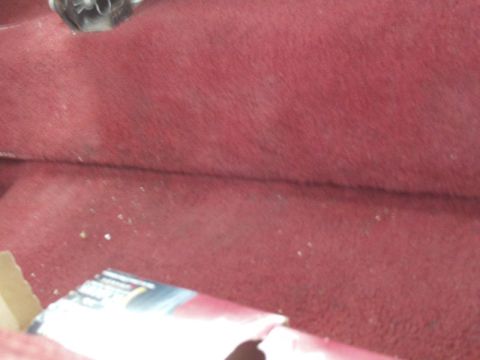 1988 Ford Bronco - The interior carpet of a vehicle is shown with a partial box and a website logo visible.