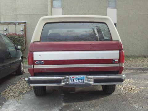 1988 Ford Bronco - This Ford Bronco features a two-tone paint scheme and a Texas license plate.