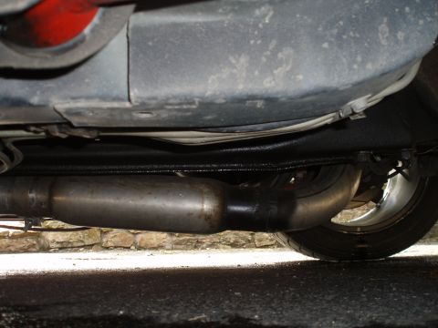 2002 Chevrolet Camaro - Close-up of the exhaust system components on the underside of a vehicle.