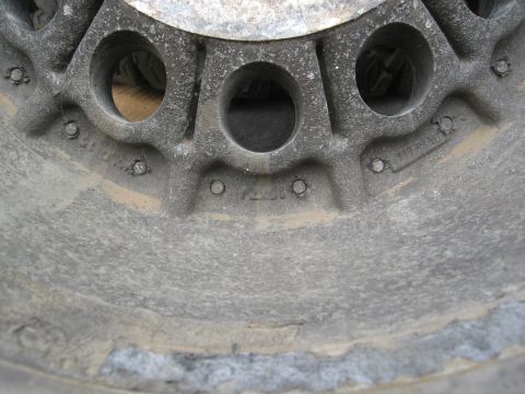 1986 Ford Bronco - A close-up view of a dusty wheel, showing a "15 x 8" marking.