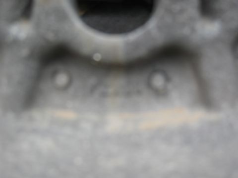1986 Ford Bronco - Close-up of an engine block casting, showing some cast-in numbers. The registry information may be incorrect.