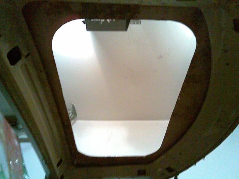 1972 Ford Ranchero - The interior of a vehicle shows an opening in the roof, possibly for a sunroof or skylight installation.