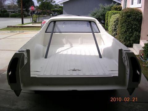 1972 Ford Ranchero - Rear view of a white 1972 Ford Ranchero pickup truck with a roll cage installed in the bed.