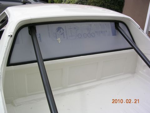 1972 Ford Ranchero - A white pickup truck's bed and rear cab window are visible, with a clear insert displaying diagrams.