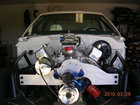 1972 Ford Ranchero - Custom V8 engine installation in a vehicle's engine bay, chrome components and a custom intake manifold.