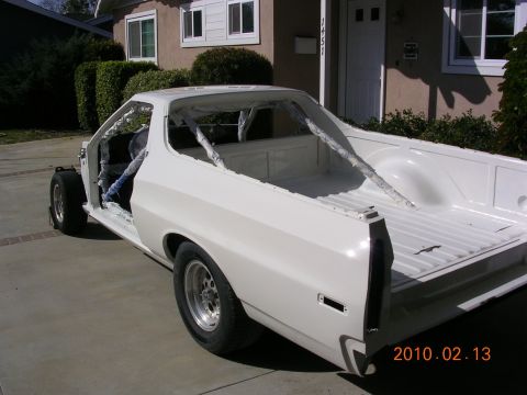 1972 Ford Ranchero - This vehicle is in the process of being restored, with its doors removed and a roll cage visible.