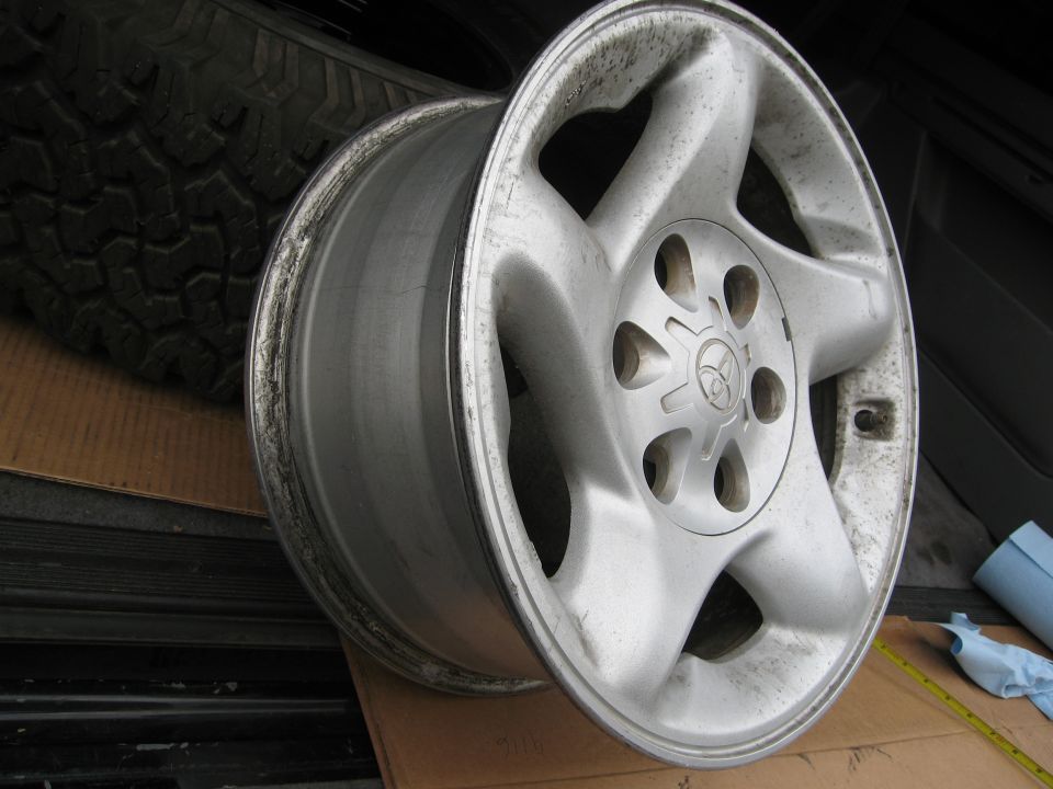 Alloy wheel with Toyota logo and five spokes