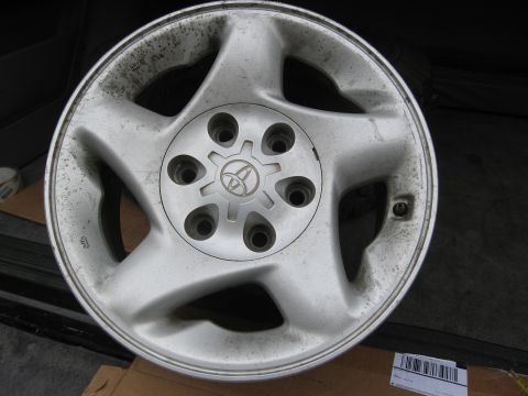 1986 Ford Bronco - This is a single silver alloy wheel with a Toyota emblem.