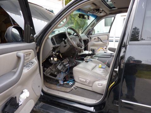 2002 Toyota Sequoia - The interior of a vehicle is shown with the dashboard and center console removed for repairs.