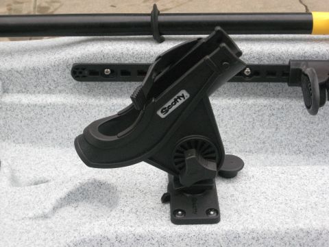 1953 Ford Mainline - Close-up of a Scotty rod holder mounted on a kayak, with a paddle resting above.