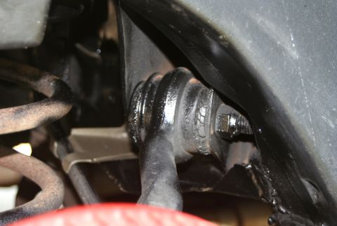 1976 Ford Ranchero - A detailed view of a vehicle's suspension system, focusing on a specific part.