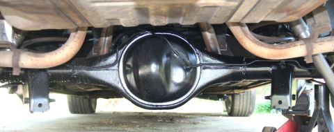 1976 Ford Ranchero - Close-up view of a vehicle's rear axle and suspension parts.