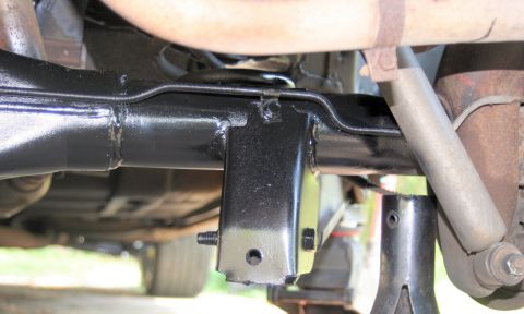 1976 Ford Ranchero - Undercarriage view shows mechanical components of a vehicle's suspension system.
