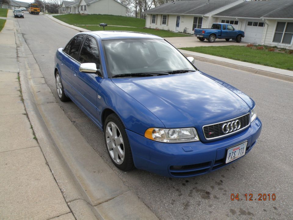 Blue 2001 Audi S4 parked on a residential street, front quarter view
