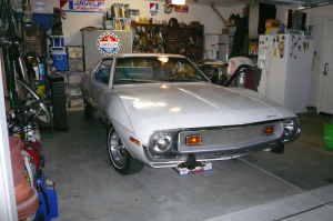 1991 Ford Bronco - White 1970s American Motors Javelin parked in a garage. The vehicle appears to be a 1970 model based on its body style.