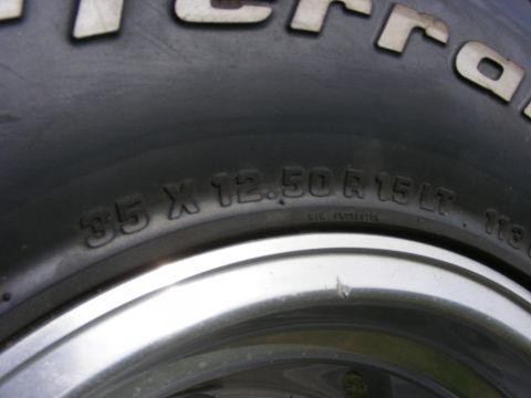 1990 Ford Bronco - Close-up of a tire displaying its size specifications: 35 X 12.50 R 15 LT.