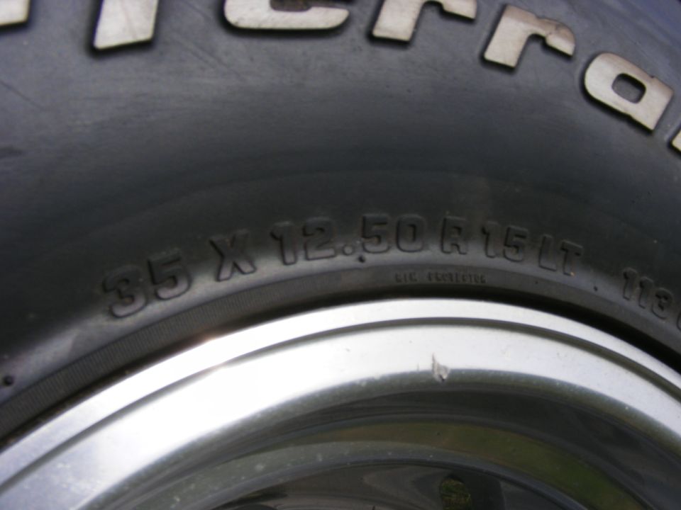 Tire sidewall close-up reading 35 X 12.50 R15 LT on a polished alloy wheel