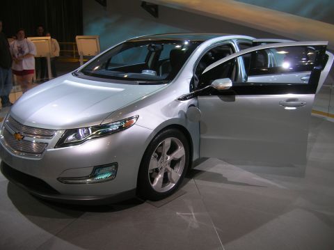 1996 Ford Bronco - A silver Chevrolet Volt is displayed with its front doors open, its interior.