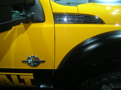 1996 Ford Bronco - Close-up of a yellow Ford F550 Super Duty truck fender and door with "DEWALT" branding.