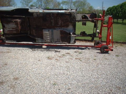 1964 Ford Fairlane - The body of a 1964 Ford Fairlane is shown upside down on a rotisserie, awaiting restoration.