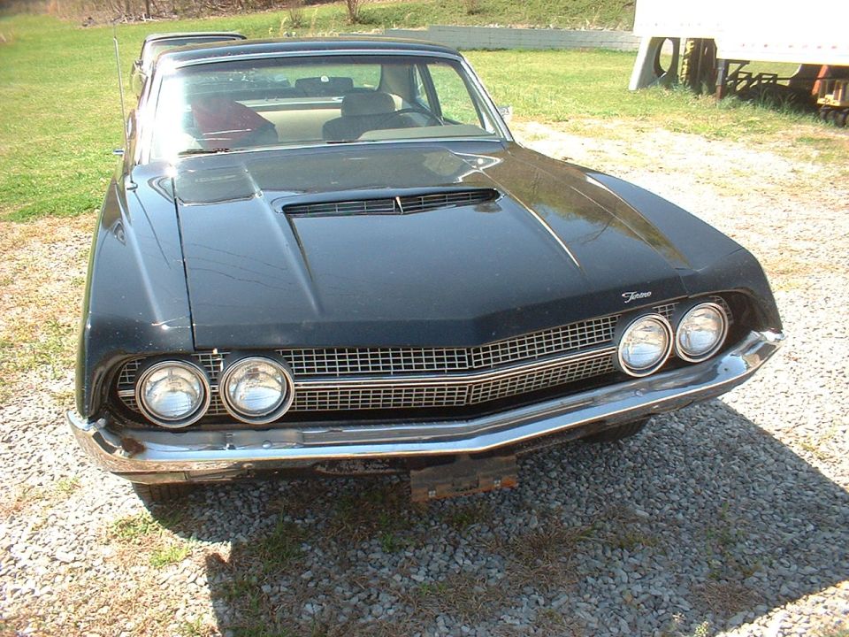 Black 1970 Ford Torino front view, showing grille and dual headlights