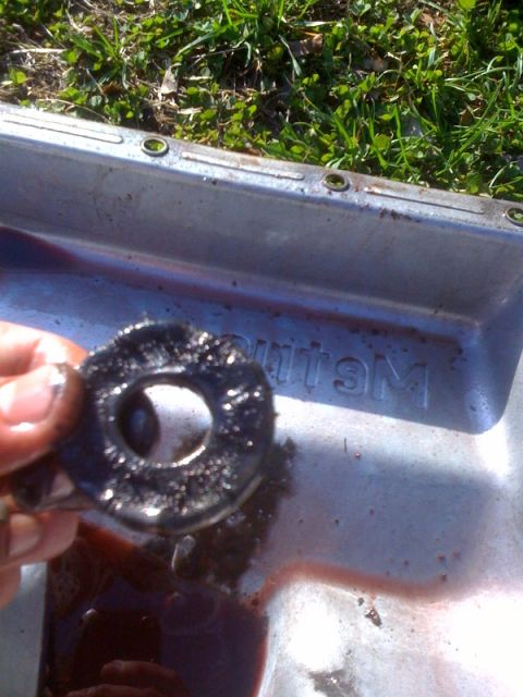 1995 Ford Bronco - Transmission pan shows metal shavings, indicating potential internal wear. Supermotors.net logo is present.
