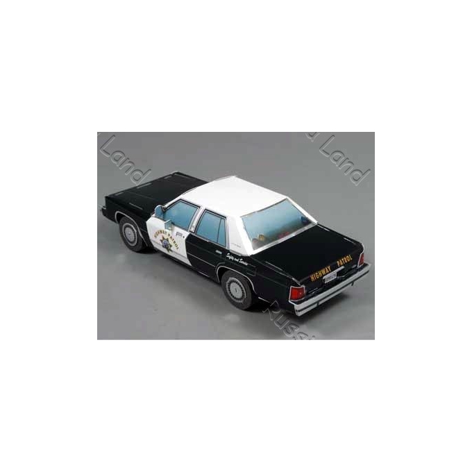 Black and white model police car with 'HIGHWAY PATROL' on the trunk