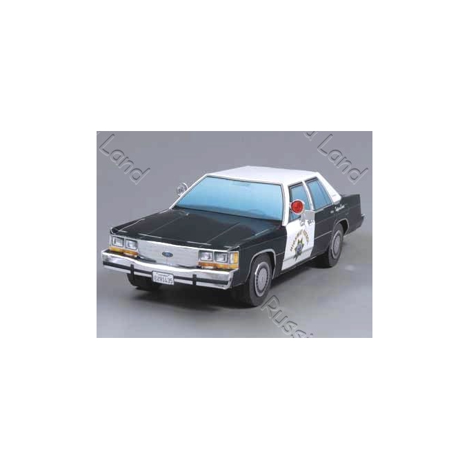 Model police car, black and white with 'Highway Patrol' text on the door