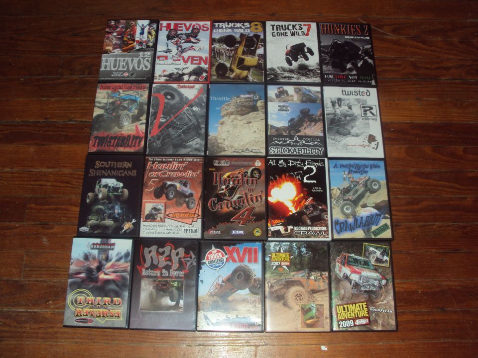 Collection of off-road vehicle DVDs on a wooden floor